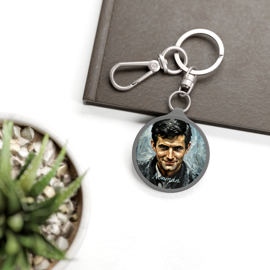 Personalized Bates Motel Key Tag used as a custom bag charm on a black backpack – Horror movie accessory.