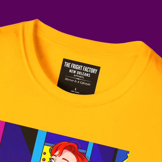 Close-up of the high-quality pop art print of Delia Deetz, showing the sharp lines and vivid ink colors on the yellow cotton fabric of the T-shirt from The Fright Factory NOLA.