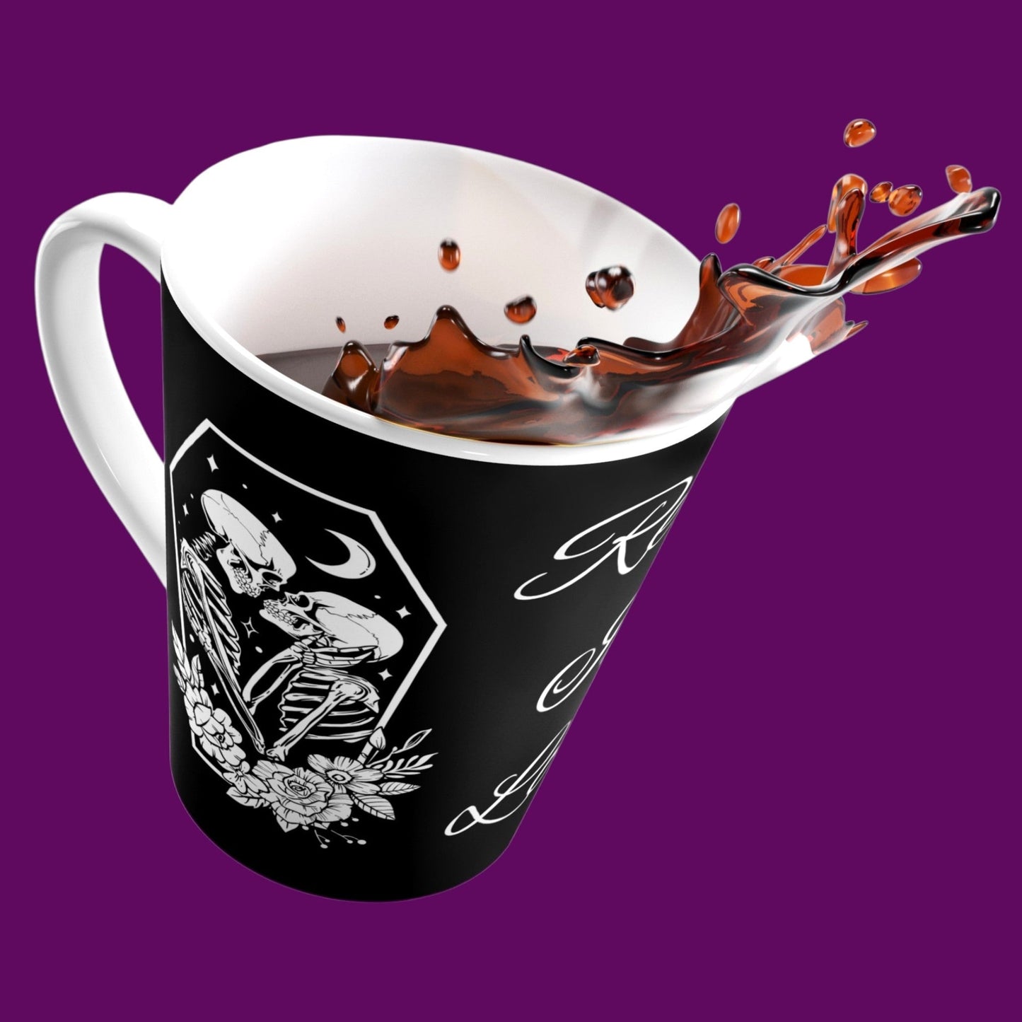 A custom matte black ceramic coffee lovers mug with a white interior, featuring two skeletons in embrace with the phrase "Rest In Love" written in elegant white cursive script down the center. Personalize in The Fright Factory New Orleans.