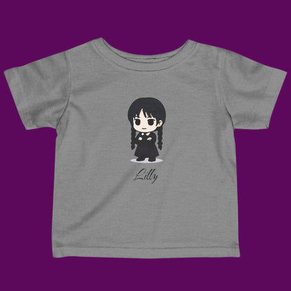 Custom Chibi Wednesday Addams inspired goth girl graphic with a personalized name on a gray kids t-shirt. Available in The Fright Factory New Orleans gift shop.
