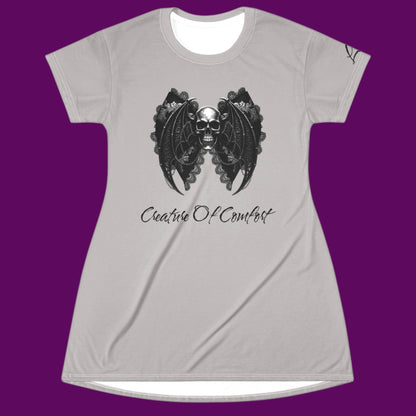 Custom Creature of Comfort graphic nightshirt styled as a gothic skull dress with a white contrast neck, featuring a bat-wing lace skull illustration for The Fright Factory, New Orleans.